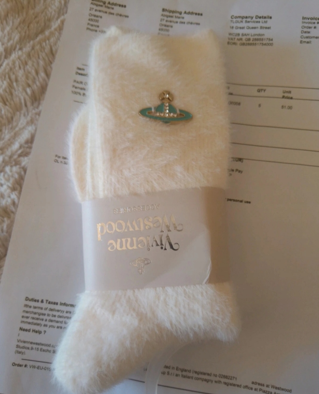Chaussettes en cotton à poil blanc et logo metalique bleu