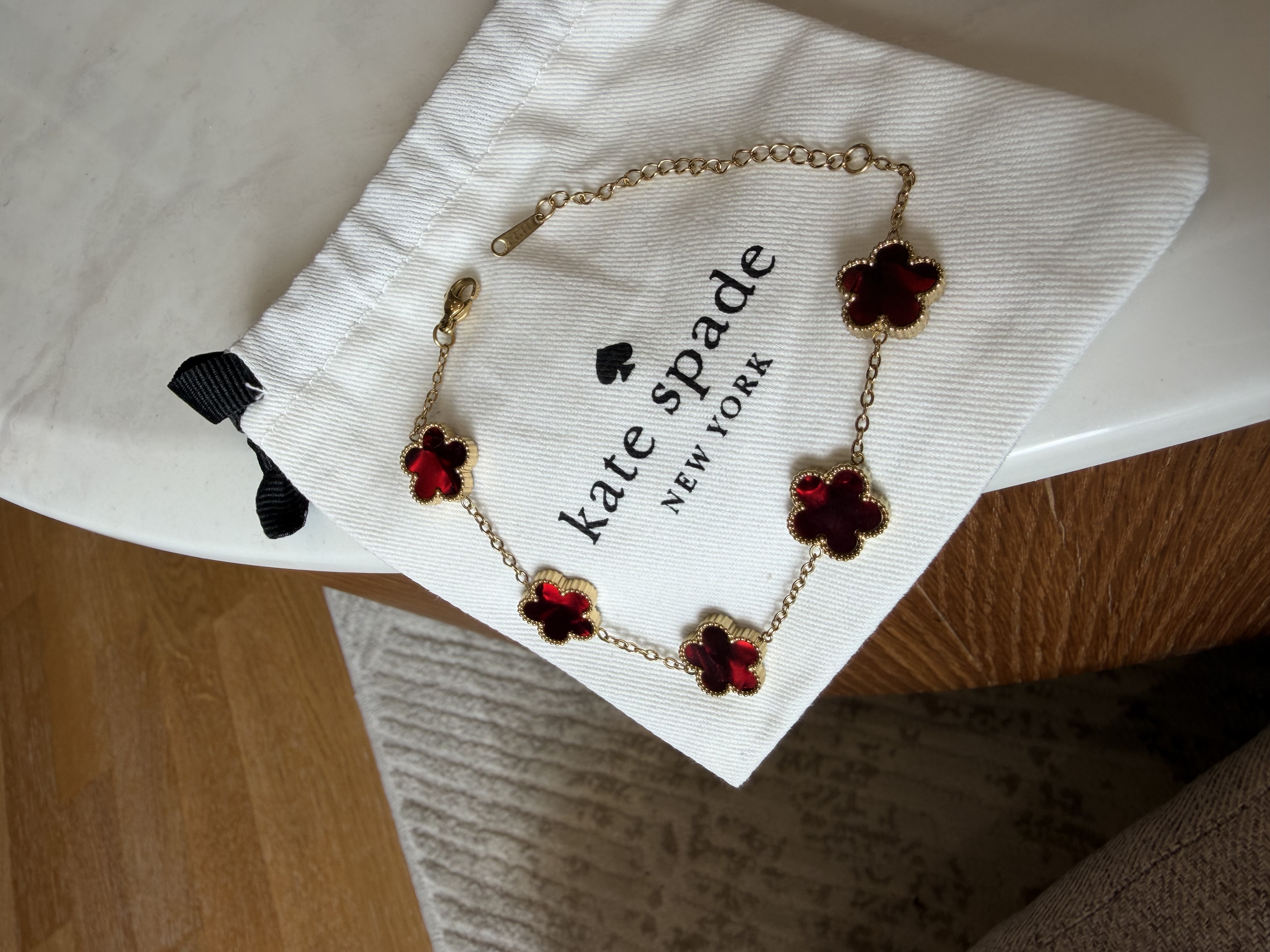 Bracelet trèfle Kate spade pour femme rouge marbre