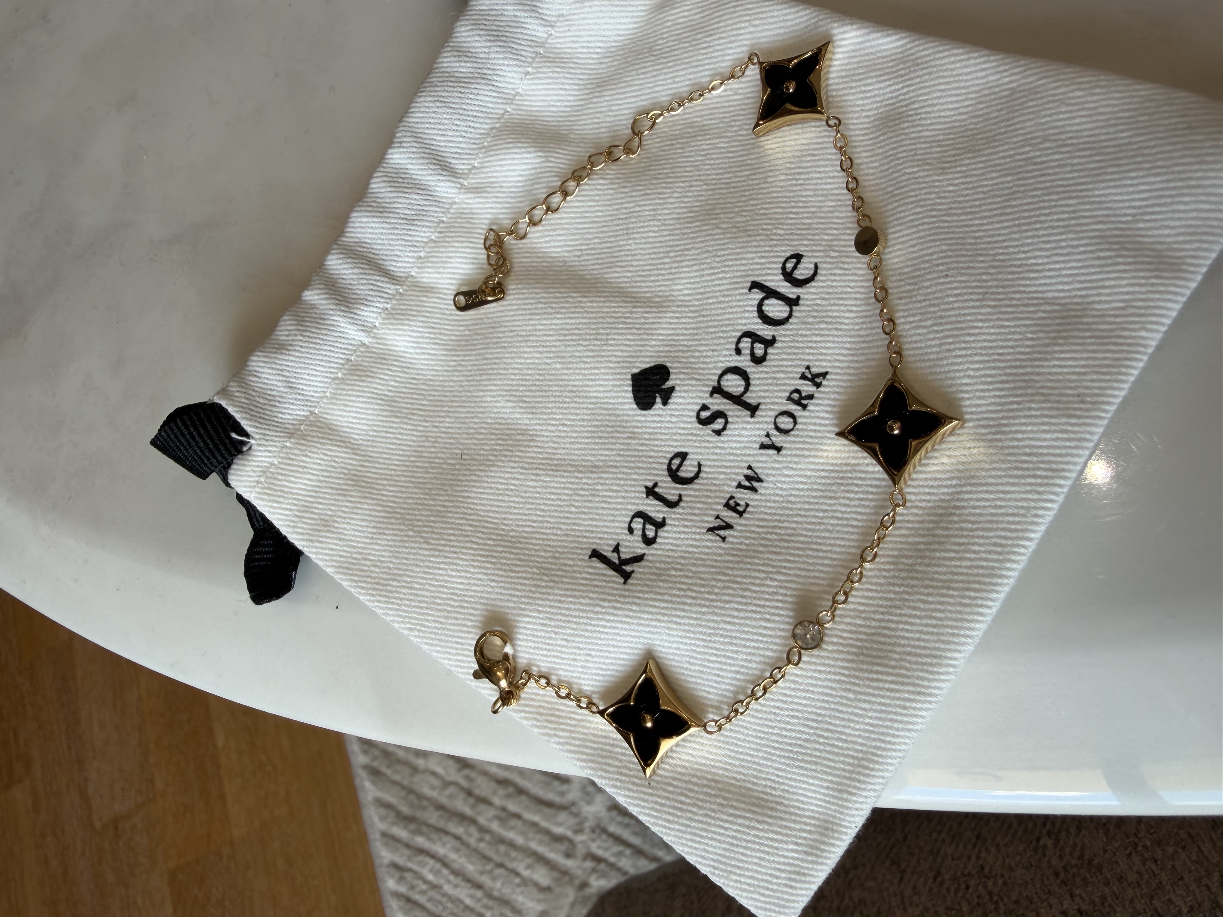 Bracelet Kate spade noir design LV
