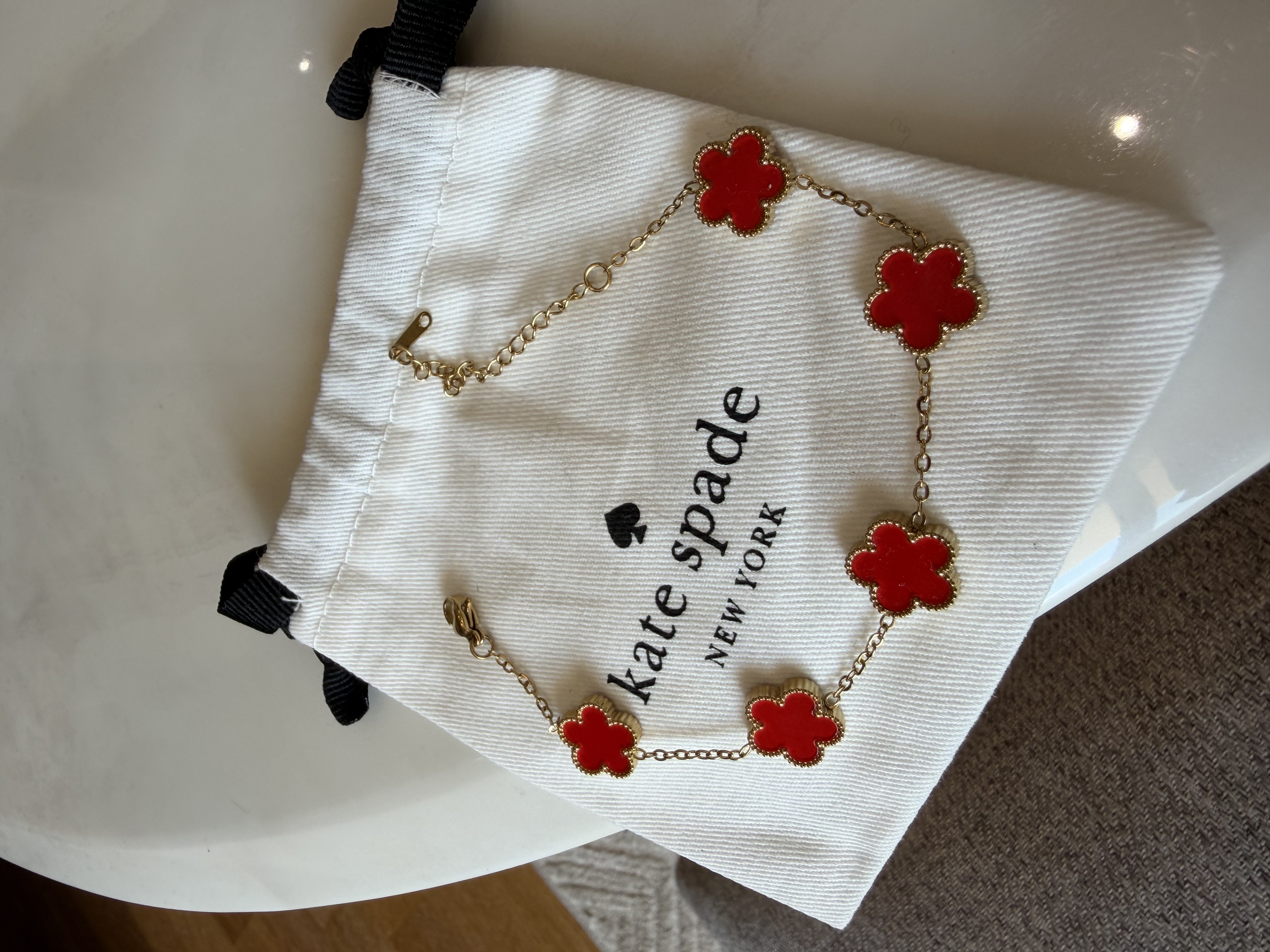 Bracelet trèfle Kate spade rouge